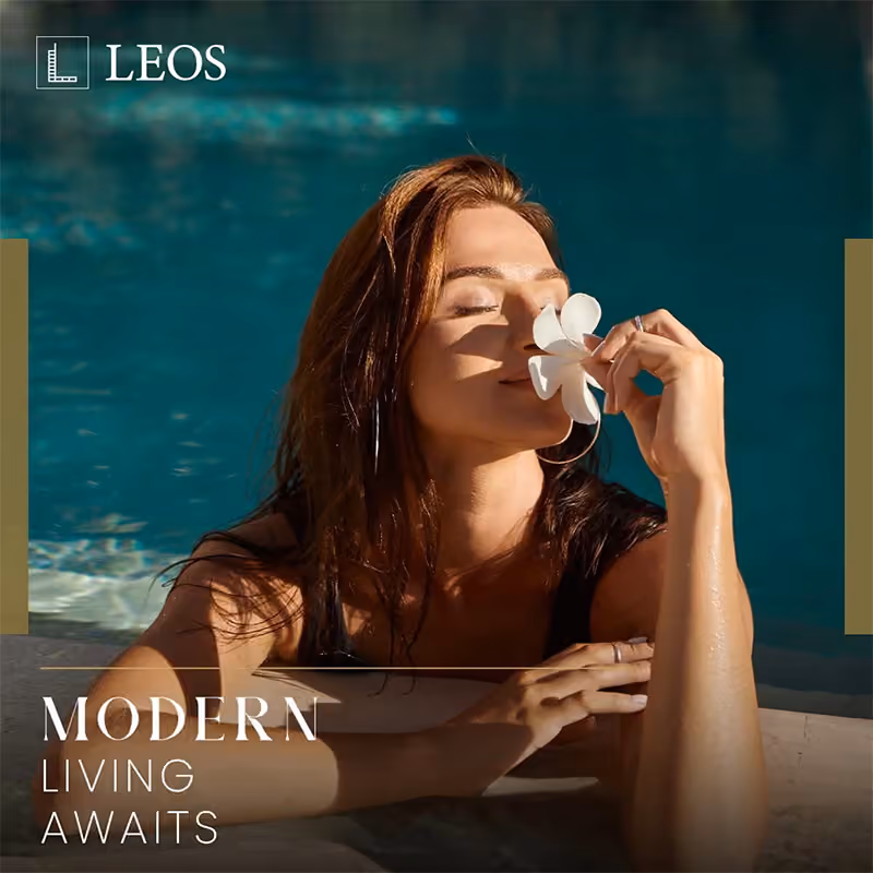 LEOS brand creative captioned Modern Living Awaits, showing a resident in a turquoise swimming pool